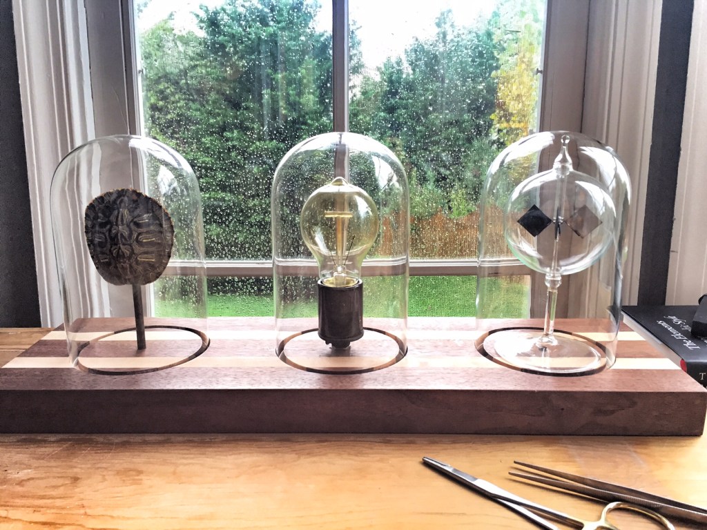 One of my favorite new lighting creations - triple dome light on handmade walnut, featuring a Crooke's radiometer that spins when the light comes on. 